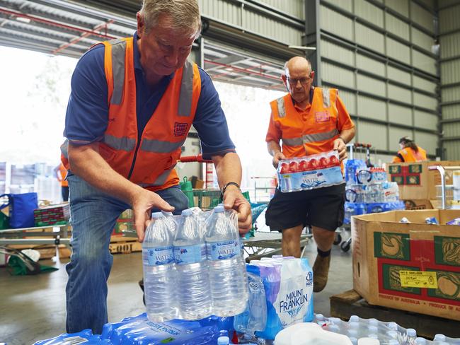 SYDNEY, AUSTRALIA - JANUARY 07: Volunteers help help organise large donations of goods at the Food Bank Distribution Centre bound for areas impacted by bushfires on January 07, 2020 in the Glendenning suburb of Sydney, Australia. Cooler conditions and light rain has provided some relief for firefighters in NSW who continue to battle bushfires across the state. The Federal Government announced the establishment of the National Bushfire Recovery Fund on Monday, with an initial $2 billion to support rebuilding efforts after the devastating bushfires which have burned across Australia in recent months. At least 20 people have died in New South Wales since the start of the fire season, while 1,588 homes have been destroyed and 653 damaged.  (Photo by Brett Hemmings/Getty Images)