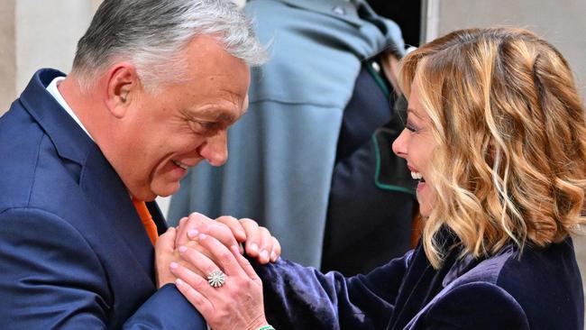 Meloni welcomes Hungarian Prime Minister Viktor Orban at Palazzo Chigi before their meeting in Rome on December 4. Picture: AFP