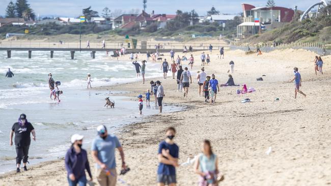 Beachgoers enjoying the weekend’s warm weather at Frankston Beach. Picture: Tim Carrafa