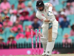 Debutant Glenn Phillips is knocked over by a Cummins peach after reaching fifty.