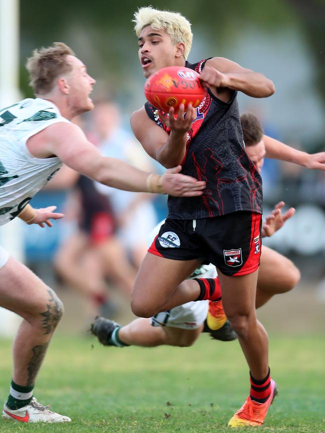 Echuca’s Cameron Valentine prepares to tackle Rochester’s Reuben Rode. Pictures: Yuri Kouzmin