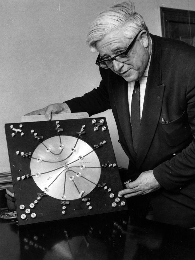 Ken McIntyre with his cyclic permutator, a mechanical device he used to create the draw for the 1970 VFL season.