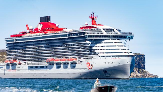 Virgin Voyages liner Resilient Lady arriving in Sydney Harbour with Sir Richard Branson in the foregroud.