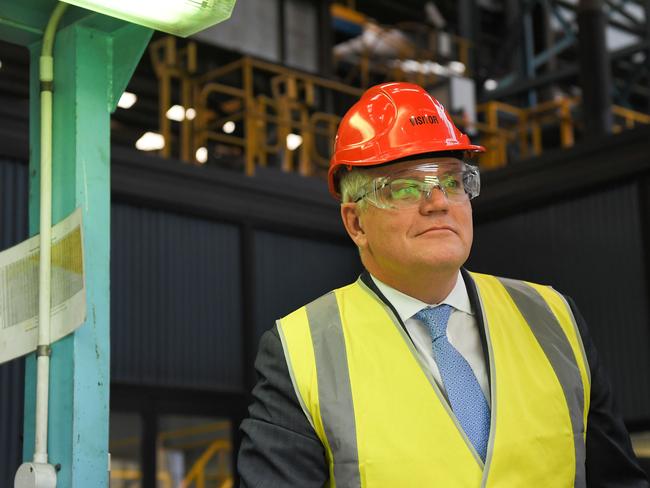 Prime Minister Scott Morrison walks through at BlueScope Steel in Port Kembla on Thursday. Picture: Simon Bullard/NCA NewsWire