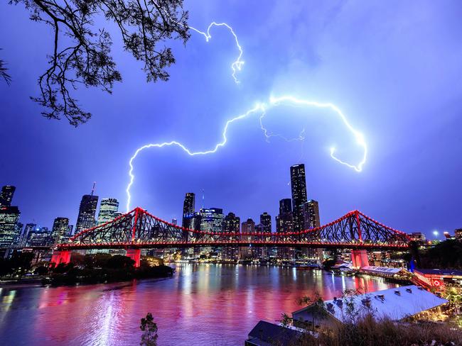 Lightning over Brisbane’s Story Bridge during yesterday’s storms. Picture: Josh Woning