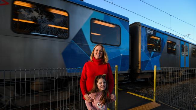 Karen Farrell and daughter Matilda, 7, at the Greville St rail crossing in Hampton. Picture: Penny Stephens