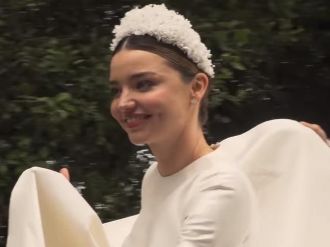 Miranda Kerr showcases breathtaking custom-made Dior wedding gown.