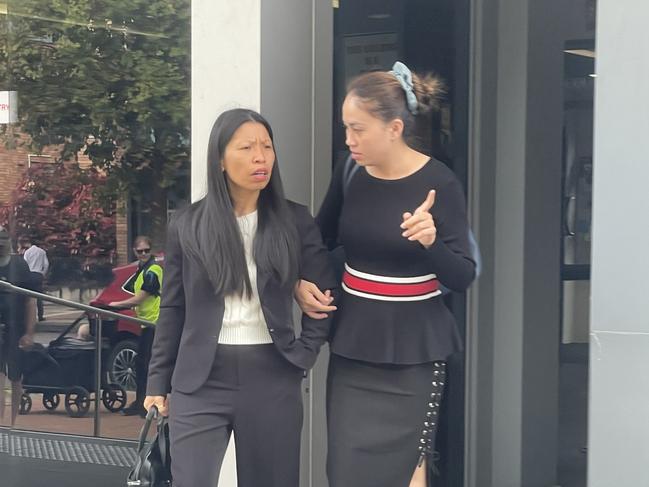 Thi Thu Hein Vu, 35, of Lake Haven (right), leaving Wyong Local Court arm-in-arm with her solicitor Camvan York (left). Picture: NewsLocal