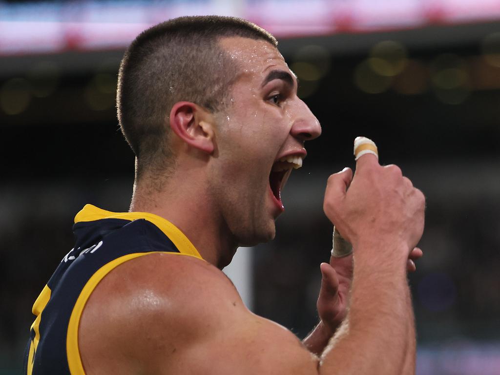 ADELAIDE, AUSTRALIA – AUG 17: Josh Rachele of the Crows gestures to the crowd after scoring a goal during the 2024 AFL Round 23 match between the Port Adelaide Power and the Adelaide Crows at Adelaide Oval on August 17, 2024 in Adelaide, Australia. (Photo by James Elsby/AFL Photos via Getty Images)