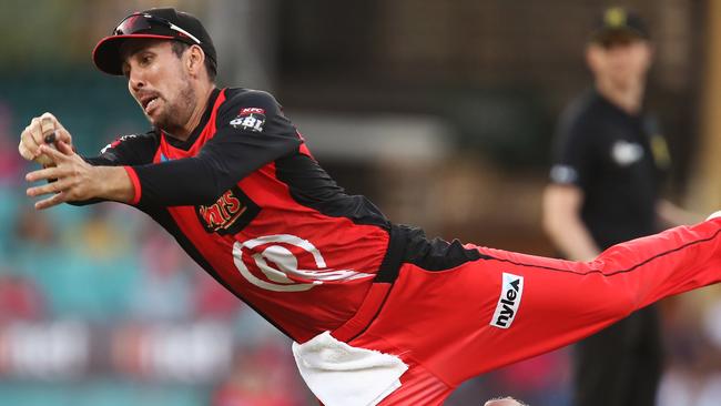 The Renegades’ Tom Cooper launches to catch the Sixers’ Moises Henriques on Wednesday night. Picture: Getty Images 