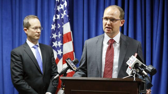 Herb Stapleton, Assistant Special Agent in Charge, FBI, right, speaks alongside U.S. Attorney Benjamin C. Glassman, left, during a news conference, Wednesday, Oct. 10, 2018, in Cincinnati. The Justice Department says a Chinese intelligence operative has been charged with stealing trade secrets from multiple U.S. aviation and aerospace companies. Yanjun Xu was charged Wednesday with conspiring and attempting to commit economic espionage and theft of trade secrets. (AP Photo/John Minchillo)