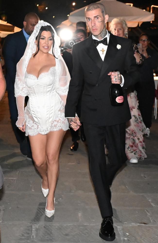 Kourtney Kardashian and Travis Barker, wearing Dolce &amp; Gabbana, tied the knot in Italy. Picture: BACKGRID Australia