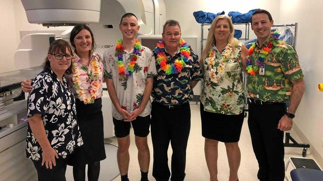 FINAL BELL: Jay Cameron (third from left) with Icon Cancer Centre staff (from left) Kate Harford and Jaimi Dawson, Dr Michael Collins, his mother Jodie Cameron and Icon site manager Brock Ditton. Picture: Contributed