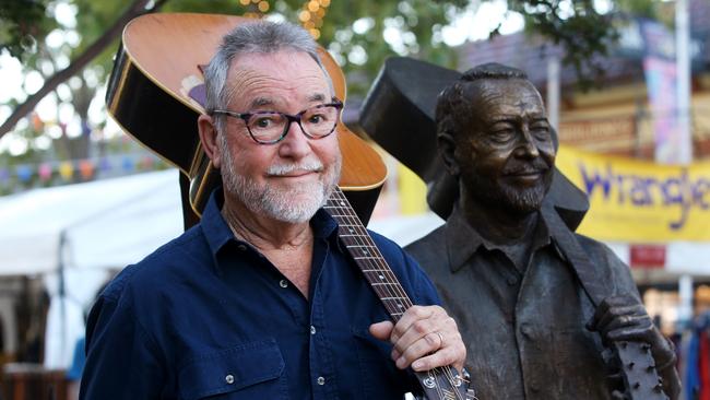 Country guitarist John Williamson alongside the new statue of him in Tamworth on Tuesday. Picture: Lisa Maree Williams