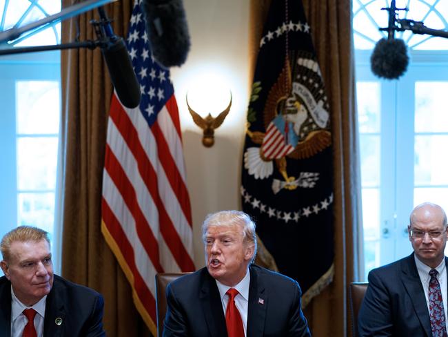 US President Donald Trump speaks on steel and aluminium tariffs next to John Ferriola of Nucor, left, and Dave Burritt of US Steel Corporation, right. Picture: AFP