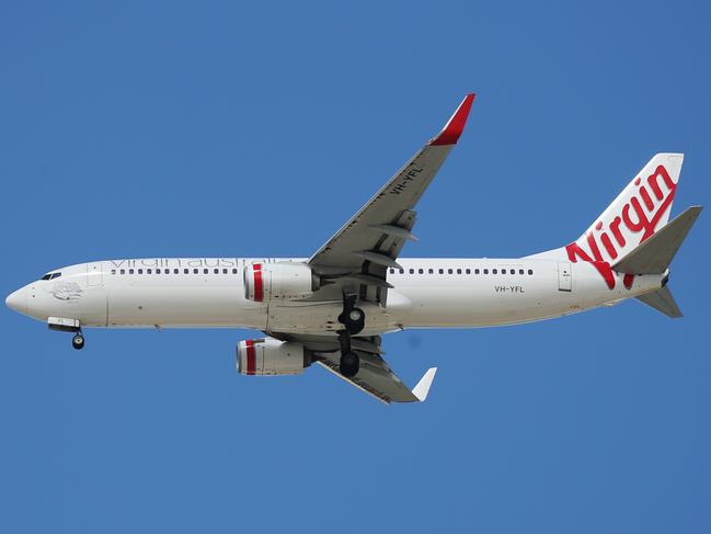 General, generic, stock photo of a Virgin Australia passenger jet airplane coming in to land at the Cairns Airport, bringing domestic tourists into the Far North Queensland region. PICTURE: BRENDAN RADKE