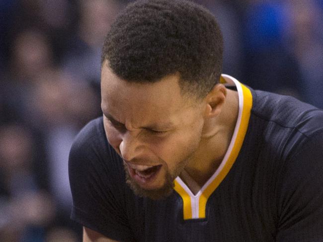 Golden State Warriors' Stephen Curry reacts after Toronto Raptors' Corey Joseph put the ball out with seconds remaining on the clock during the second half of an NBA basketball game in Toronto, Saturday, Dec. 5, 2015. (Chris Young/The Canadian Press via AP) MANDATORY CREDIT