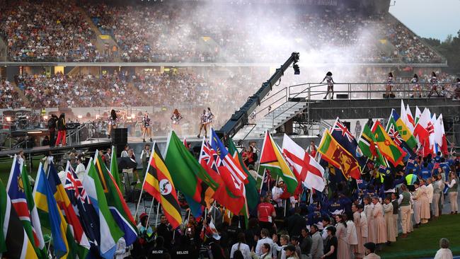 Athletes celebrate with their flags.