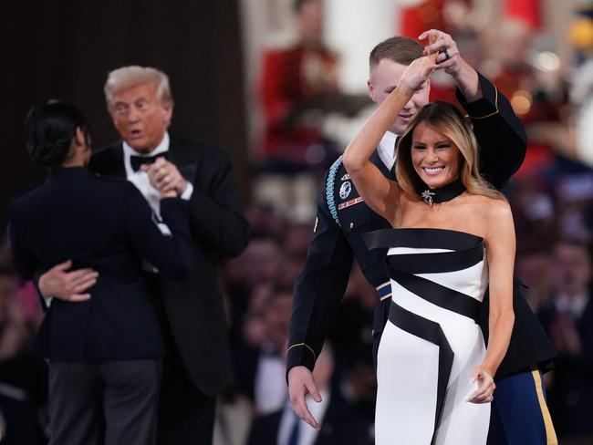 WASHINGTON, DC - JANUARY 20: Melania Trump and President Donald Trump dance at the Commander-in-Chief Ball on January 20, 2025 in Washington, DC. President Trump attends some of the inaugural balls after taking the oath as the 47th president.   Andrew Harnik/Getty Images/AFP (Photo by Andrew Harnik / GETTY IMAGES NORTH AMERICA / Getty Images via AFP)