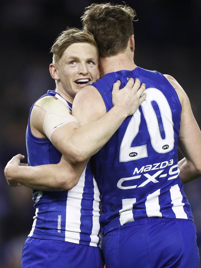 Jack Ziebell embraces key forward Nick Larkey.