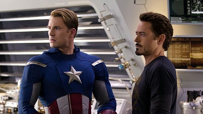 Chris Evans, portraying Captain America, left, and Robert Downey Jr., portraying Tony Stark, act in a scene from Marvel's 'The Avengers'.