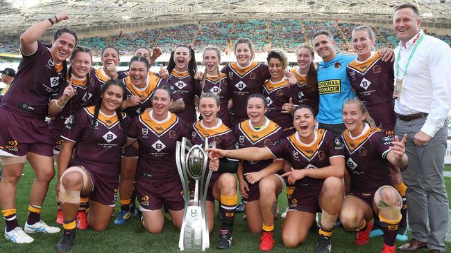 Brisbane's players celebrate victory in the 2019 NRLW grand final.