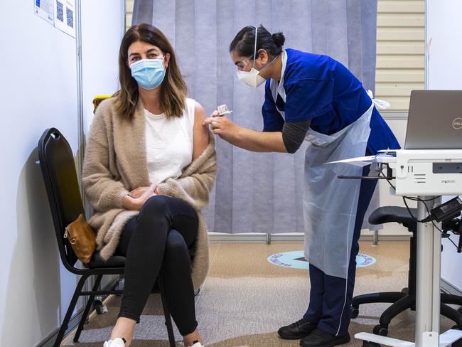 Fiona Simmonds has her second Pfizer Covid-19 vaccine at the Melbourne Showgrounds vaccine hub. Picture: Aaron Francis