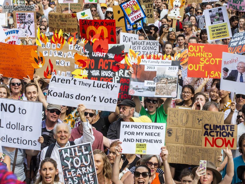 SYDNEY, AUSTRALIA - JANUARY 10: (EDITOR'S NOTE: Image contains profanity.) Activists rally for climate action at Sydney Town Hall on January 10, 2020 in Sydney, Australia. Protests around the country were organised in response to the ongoing bushfire crisis in Australia. Fires in New South Wales, Victoria, Queensland, Western Australia and South Australia have burned 8.4 million hectares of land. At least 25 people have been killed, including three volunteer firefighters, and thousands of homes and buildings have been destroyed. (Photo by Jenny Evans/Getty Images)