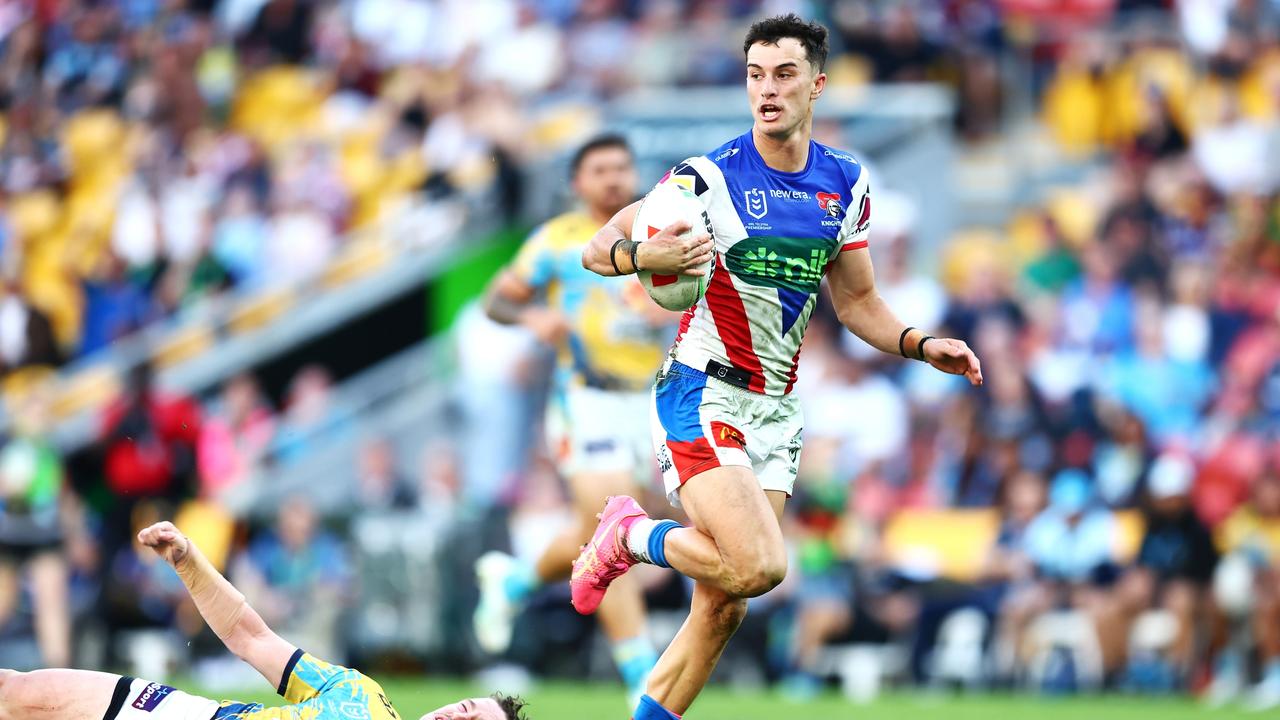 David Armstrong of the Knights breaks away to score a try against the Gold Coast Titans.