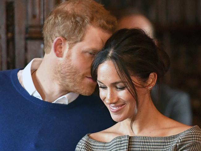 Britain's Prince Harry and Meghan Markle watch a performance Cardiff Castle in Cardiff, Wales, Thursday, Jan. 18, 2018. During their tour, Prince Harry and Ms. Markle will hear performances from musicians and poets, meet sportsmen and women, and see how organisations are working to promote Welsh language and cultural identity. (Ben Birchall/Pool Photo via AP)