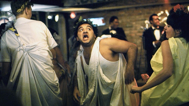 Actor John Belushi wearing a toga in a scene from <i>National Lampoon's Animal House</i>.