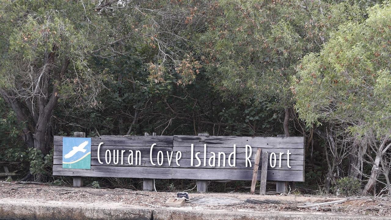 Residents have placed two logs over the entrance sign to Couran Cove. Picture: Tertius Pickard