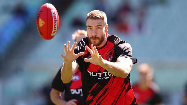 MELBOURNE, AUSTRALIA - MARCH 22: Ben McKay of the Bombers warms up ahead of the round two AFL match between Essendon Bombers and Adelaide Crows at Melbourne Cricket Ground, on March 22, 2025, in Melbourne, Australia. (Photo by Morgan Hancock/AFL Photos/via Getty Images)