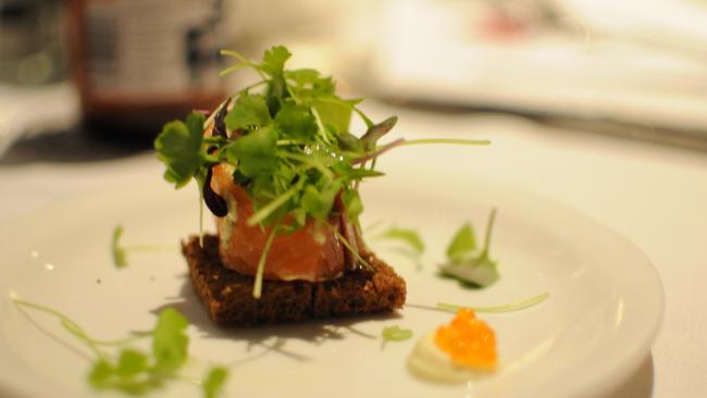 Oakwood smoked Tasmania salmon and cream cheese roulade on homemade rye bread.