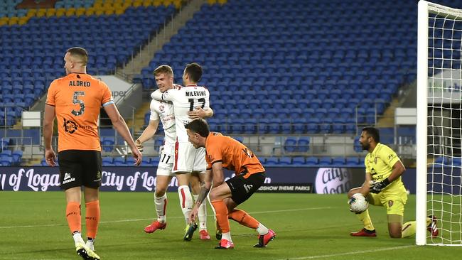 Adelaide United’s Kristian Opseth, second from left, celebrates after scoring against Brisbane Roar at Cbus Super Stadium on the Gold Coast. Picture: Getty Images