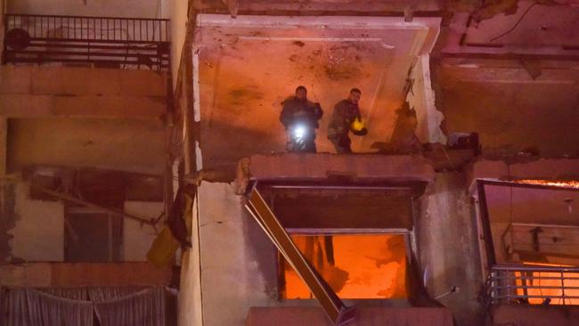 Firefighters search for survivors inside a Beirut apartment building. Picture: AFP