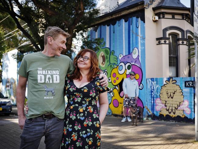 DAILY TELEGRAPH - 4/9/24Sara Palmieri and partner Darryl Hughes picture in front of their home in Newtown which has a mural by street artist ÃKrispieÃ (SarahÃs brother wearing hat and sunglasses) and is also up for sale.  Picture: Sam Ruttyn