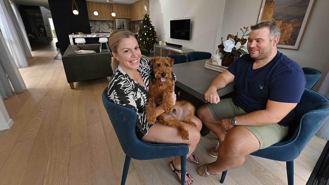 Sharlene and Sean Bryce, with dog Charlie, are selling their home in Camp Hill ahead of an expected property boom in the suburbs of Brisbane. Picture: Lyndon Mechielsen