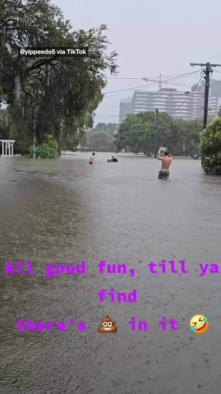 Aussies swim in sewage water flowing through Brisbane’s floodwater