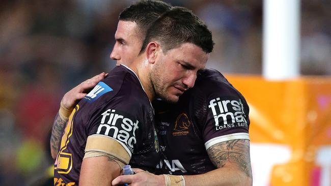 Matt Gillett and Darius Boyd react after the Broncos’ 2015 grand final defeat to the Cowboys.