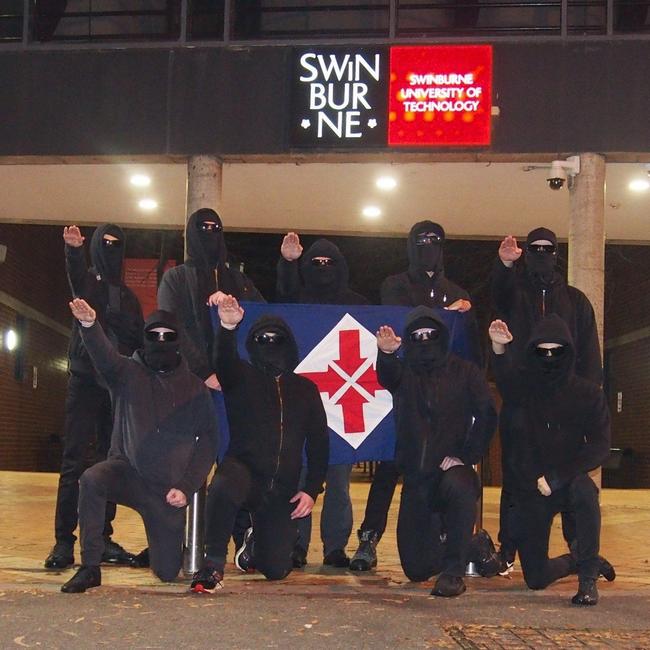 Neo-Nazi group the National Socialist Network performing Hitler salutes at Swinburne University in Melbourne.