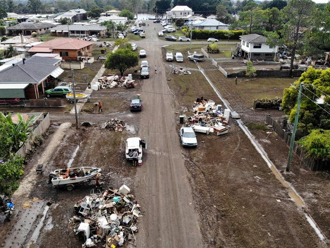 Lismore’s clean-up involved removing tonnes or debris and damaged goods daily. Picture: Toby Zerna