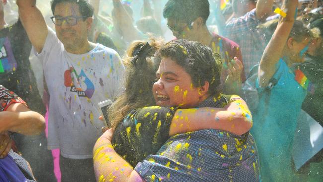 People celebrate the Yes vote at the State Library in Melbourne. Picture: Jason Edwards