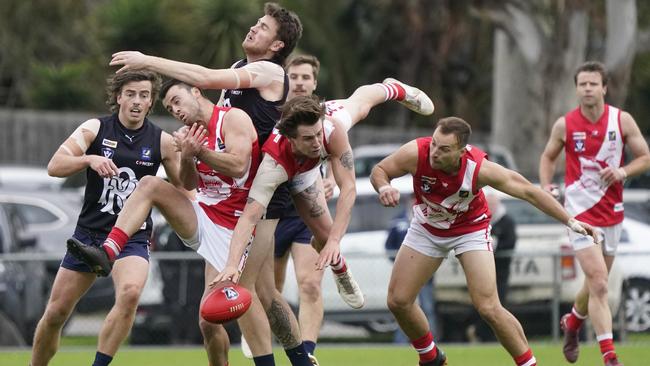 A flying Chad Harris gets his hand on the ball for Sorrento. Picture: Valeriu Campan