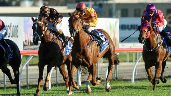 Amata (red cap) wins at the Gold Coast on Saturday. Photo: TRACKSIDE PHOTOGRAPHY/BRUCE THOMAS