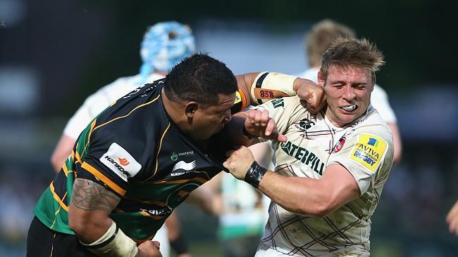 Salesi Ma'afu (L) hits Leicester hooker Tom Youngs.