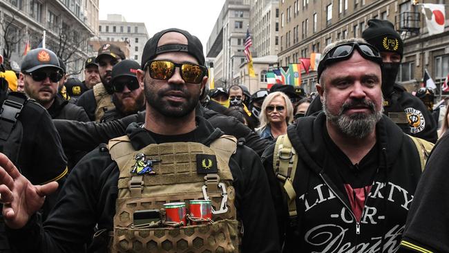 Enrique Tarrio, leader of the Proud Boys, left, was arrested in January, charged in connection with unrest following pro-Trump protests in Washington. Picture: Stephanie Keith/Getty Images/AFP