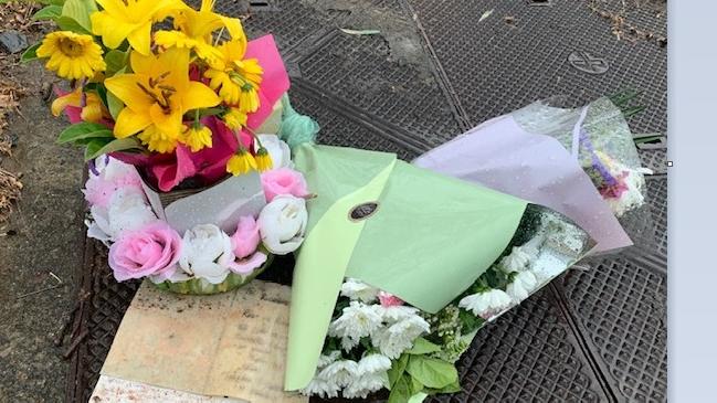 Flowers and a mother’s letter to her dead son were left at the corner of Lima St and Castile Crescent at Holmview.