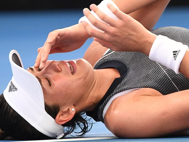 Garbine Muguruza of Spain after sustaining an injury during her second round match against Aleksandra Krunic of Serbia at the Brisbane International Tennis Tournament in Brisbane, Tuesday, January 2, 2018. (AAP Image/Dave Hunt) NO ARCHIVING, EDITORIAL USE ONLY