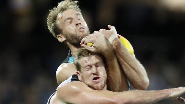 Jack Hombsch collides with Tom Jonas at Adelaide Oval. Picture: Sarah Reed.                        <a capiid="5704bddf4e65f83aa0b67db7f0bb995d" class="capi-video">Port Adelaide 'Not good enough'</a>